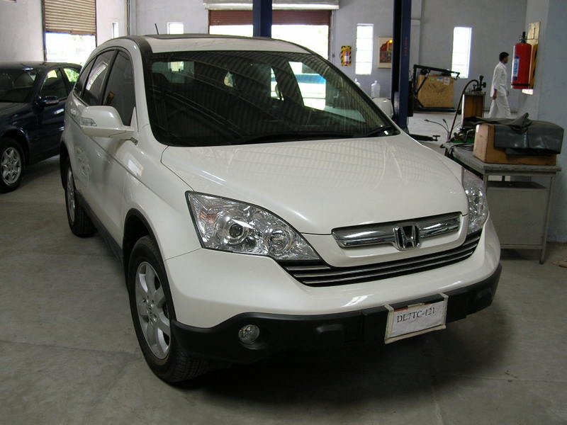 The car, a gleaming white 2007 Honda CR-V, delivered at the workshop a day 