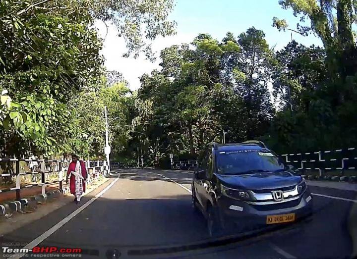 Video: Almost hit a lady walking on the road to avoid oncoming car 