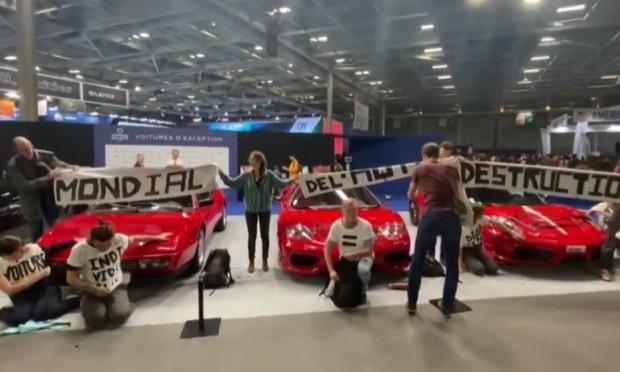 Protestors glue their hands to supercars at Paris Motor Show 