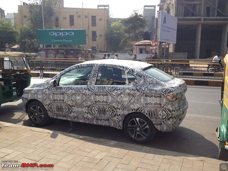 Tata Tiago-based compact sedan. EDIT: Tigor launched at Rs 4.7 lakhs-tatakite5sedantopendvariantsidespied.jpg