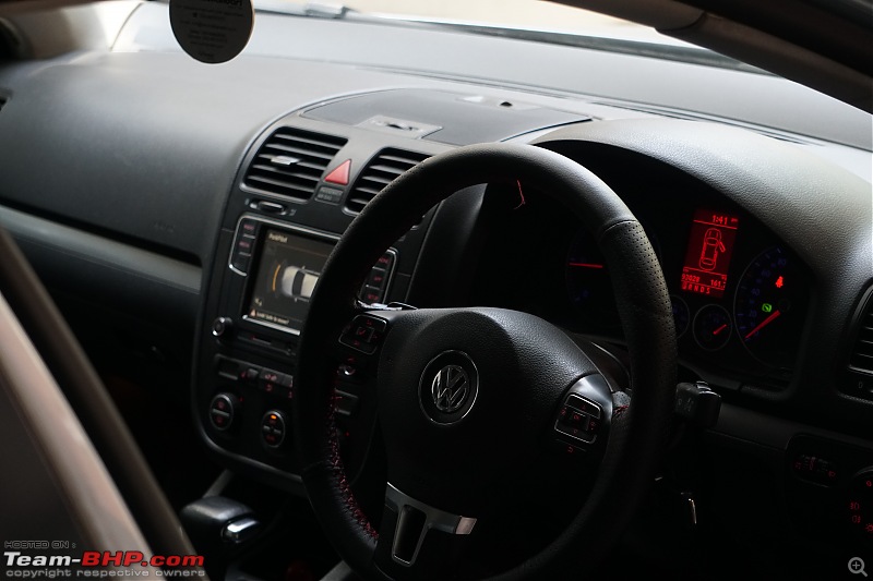 Our first tryst with Volkswagen | Ownership Review of our MK5 VW Jetta-red-stitching-red-accents.jpg