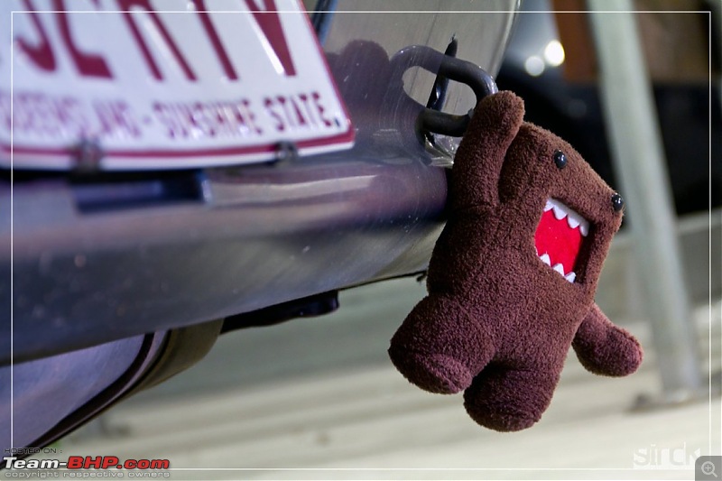What are those colorful straps hanging off the rear tow hook of cars?-161064.jpg
