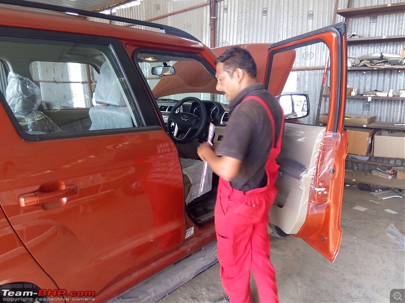 Mahindra TUV300 : Official Review-technician-inspecting-right-side-car.jpg