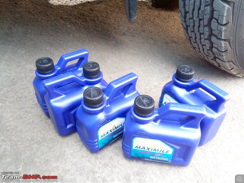 Mahindra TUV300 : Official Review-five-cans-1-litre-coolant-lined-up-filling-my-tank.jpg