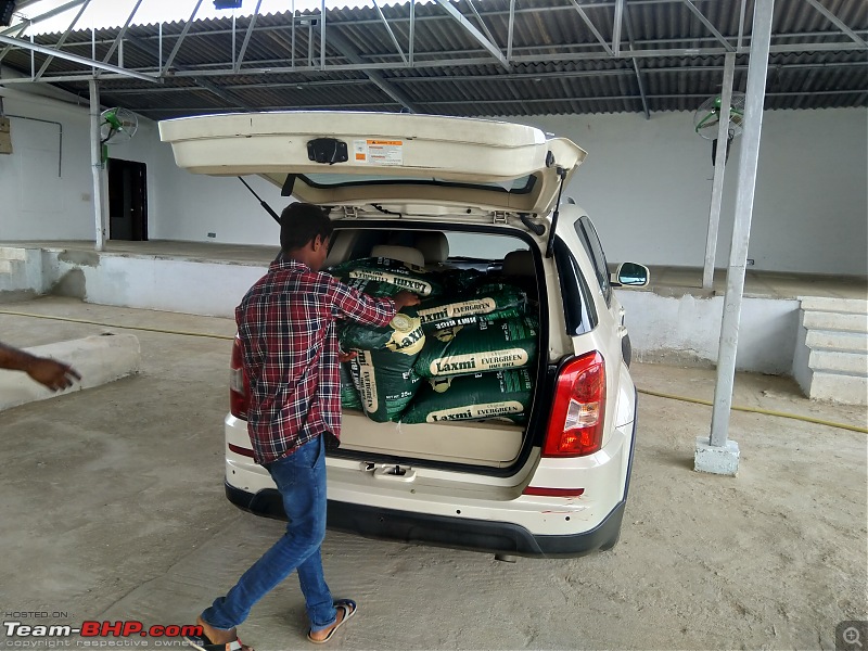 Which utility vehicle for charity? Need to carry food for poor families-unloading-rice-bags..jpg
