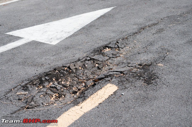 Concrete Roads vs Asphalt Roads | Understanding the pros & cons-tar-road-damaged.jpg