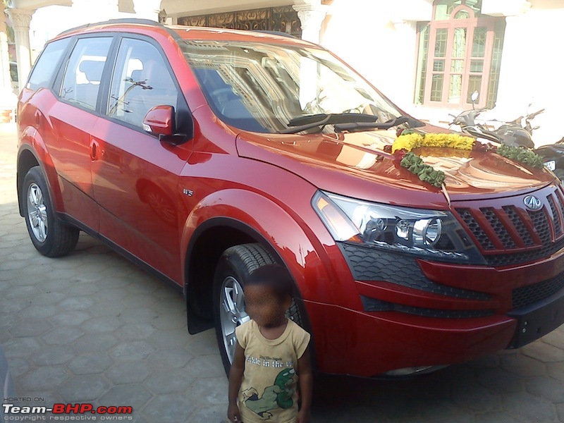 Sita, Red Mahindra XUV5OO W8 joins our Family. EDIT: 1 Year & 35,000 kms up-front-view.jpg