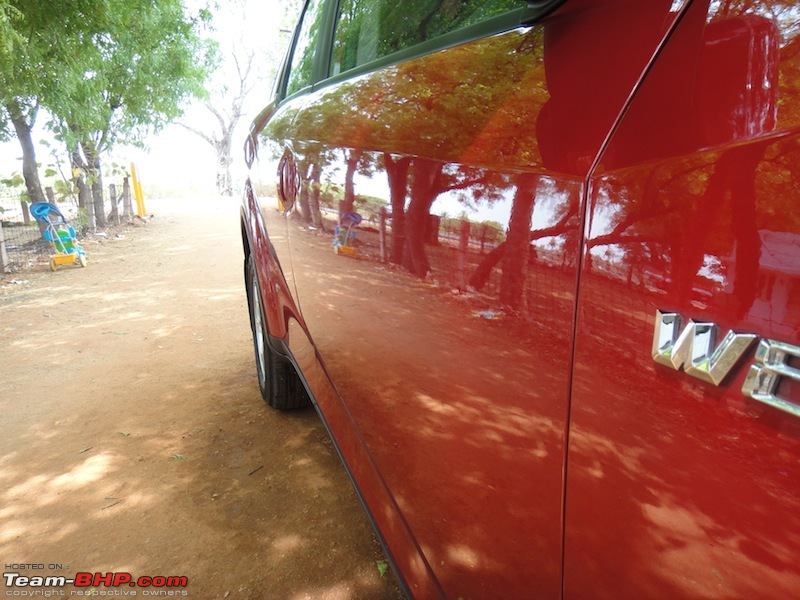 Sita, Red Mahindra XUV5OO W8 joins our Family. EDIT: 1 Year & 35,000 kms up-side-angle.jpg