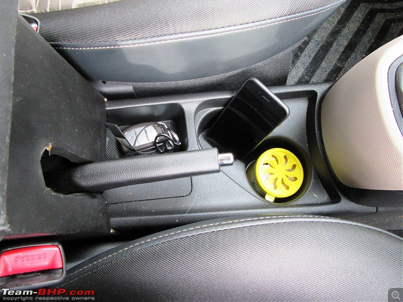 Hyundai Grand i10 Asta (O) AT comes home-storage-space-near-handbrake.jpg