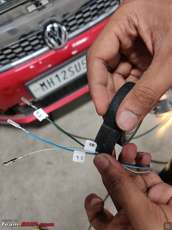 Review: Driving home our Sunset Red VW Polo Highline+ TSI Automatic-taping-some-headlight-harnesses.jpg