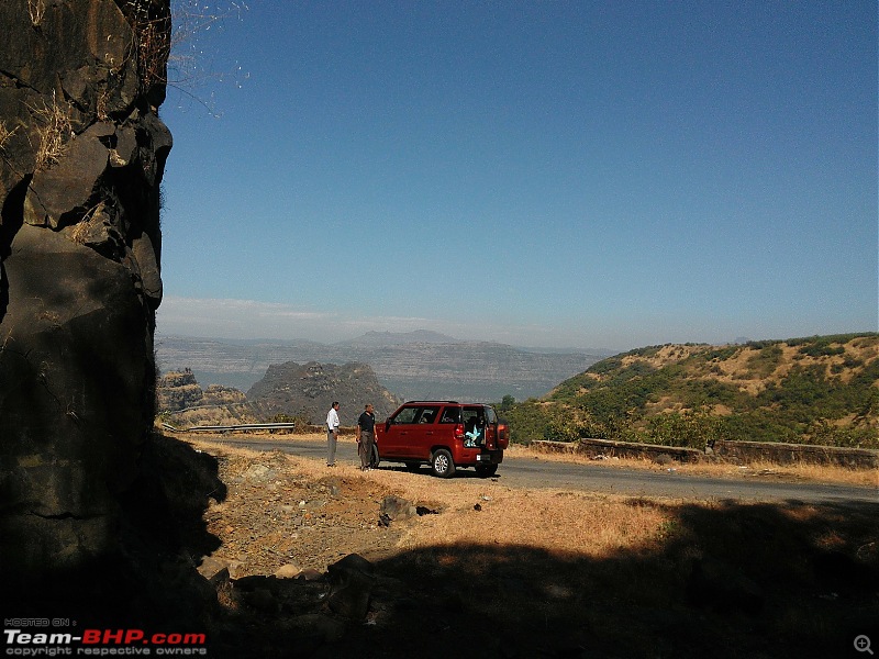 With my TUV300 to Sinhagad Fort, Balaji Temple, Narayanpur & Shivthar Ghal-25tuv-seen-some-distance-behind-rock-cliff.jpg