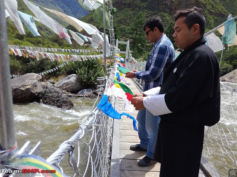 Drive from Kolkata to Bhutan in my Honda Civic-deepesh-helping-me-prayer-flags-2-day-4.jpg