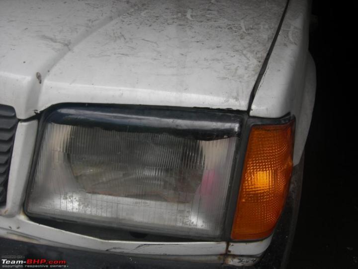 Why did people put black strip on their headlights in the 90s 