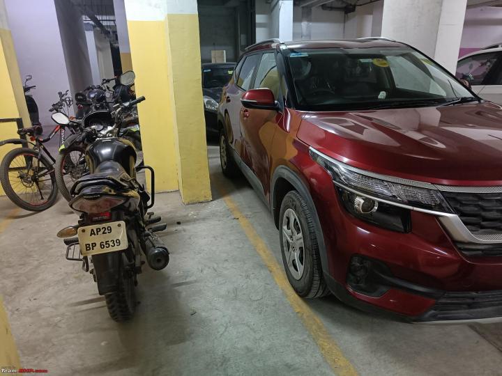 My Kia Seltos gets damaged in society parking after bike falls on it 