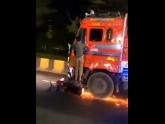 Biker hangs on to truck after hit